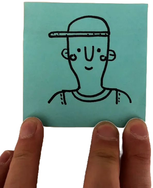 A hand holding a sticky-note self-portrait of YC